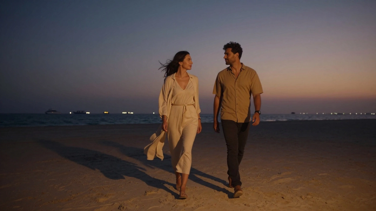 Two people walk silently along Jumeirah Beach at sunset, shadows stretching on sand, distant yachts glowing softly.